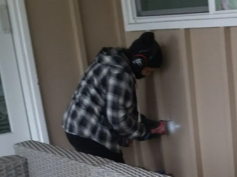 Professional electrician installing an exterior outlet in Sullivan City