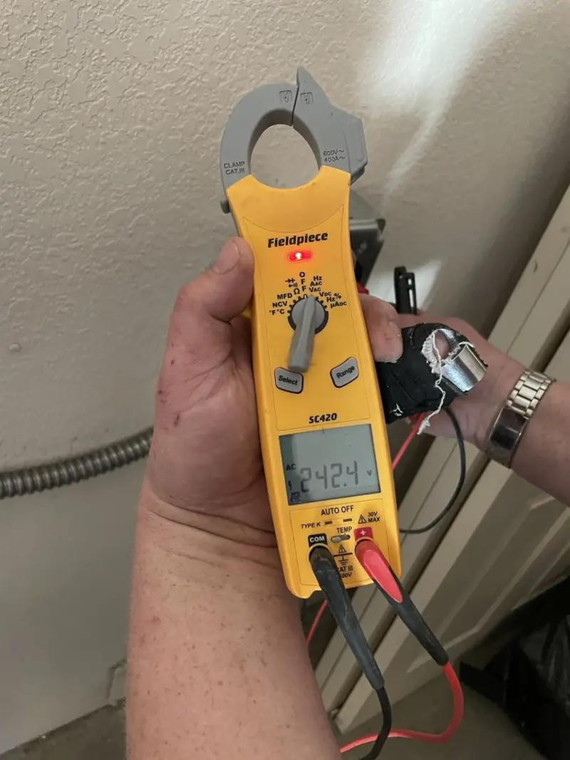 Voltage testing with clamp meter during Outlet Installation in Sullivan City